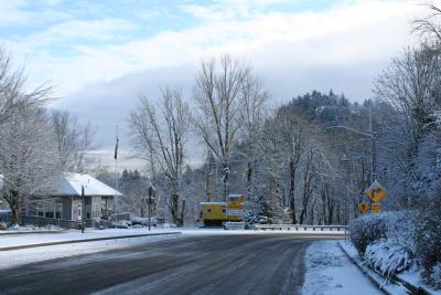 An ice-covered Historic Columbia River Hwy at the edge of Troutdale curves to the right